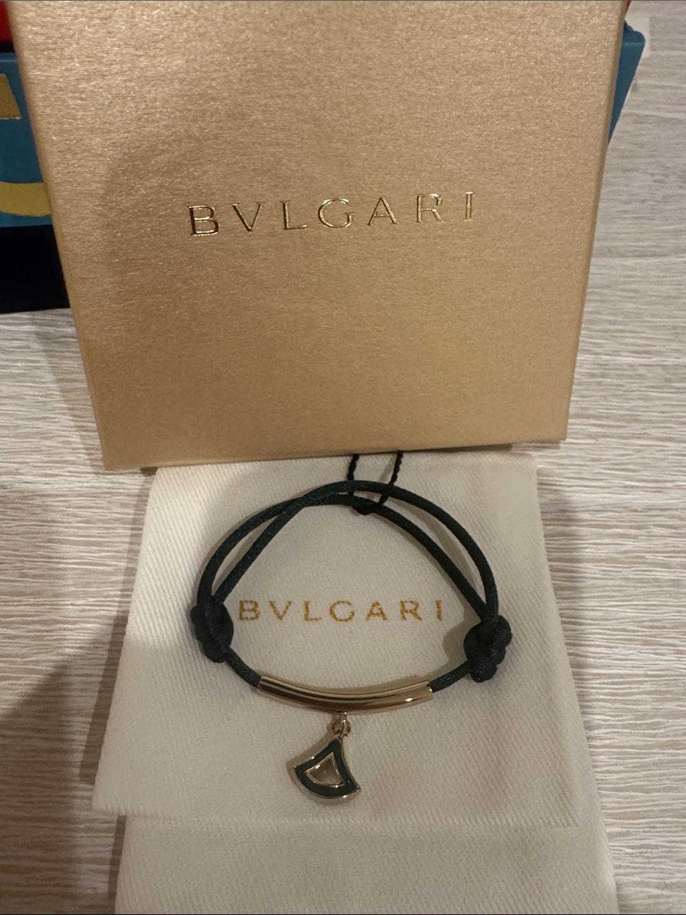 Bulgari green cord bracelet with pendant